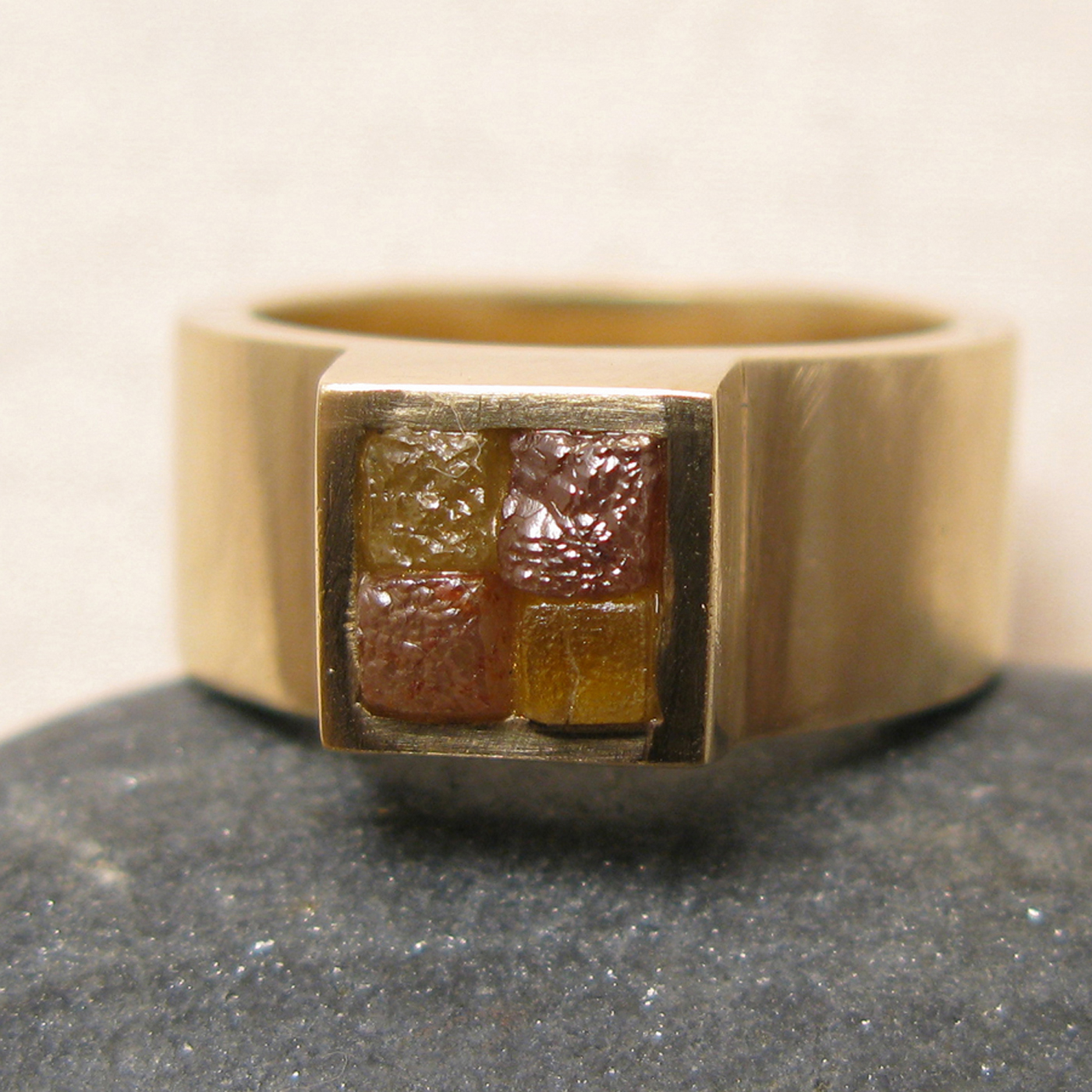 Gold ring with colored diamonds