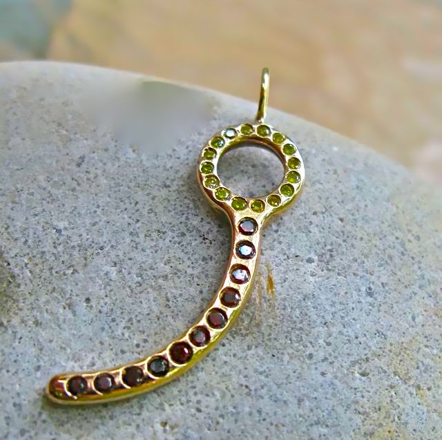 Gold closing pin pendant