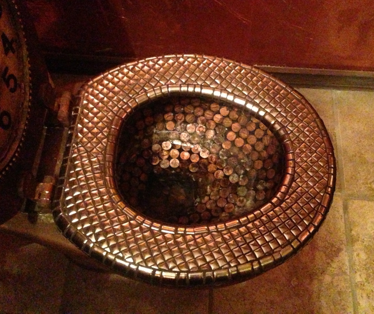 Toilet with copper pennies