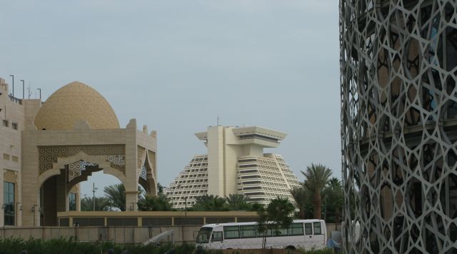Hodge podge of styles: (from L>R) local traditional, modern (Sheraton pyramid) and base of an ugly tower with a metal laced exterior which we call the ‘corndog’ building because it looks like a corndog!